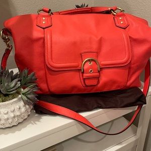 Poppy color Coach bag with crossbody strap and gold hardware